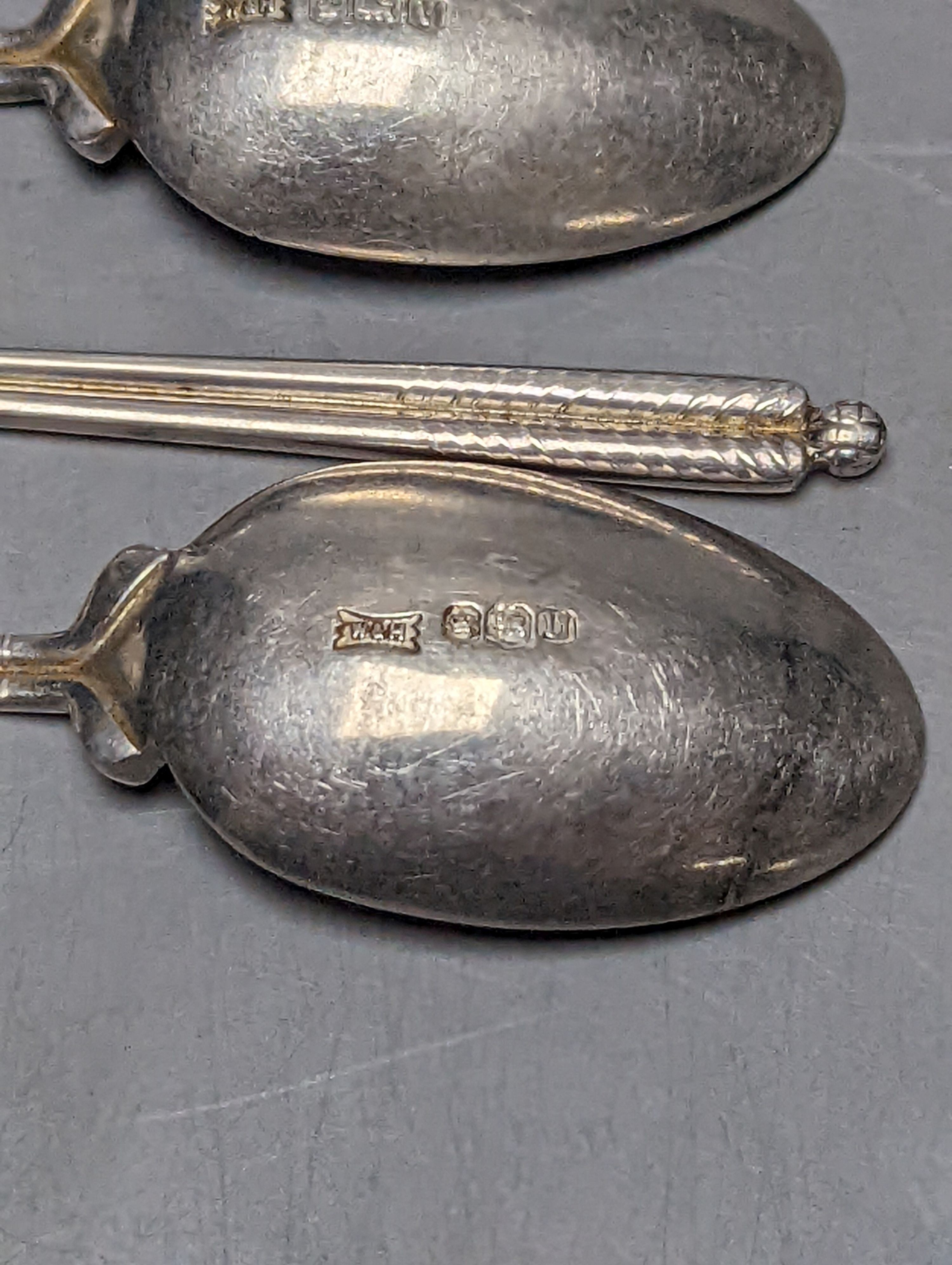 A set of six 1960's silver golfing related coffee spoons, by Walker & Hall, 68 grams.